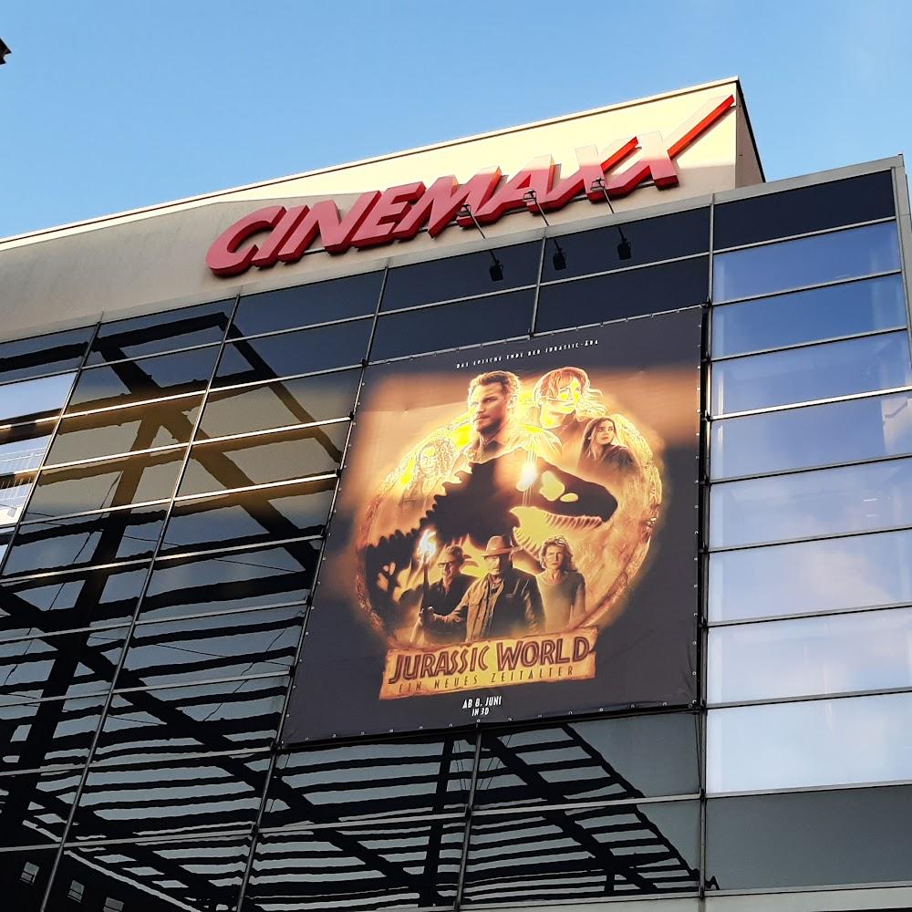 A movie theater with a Jurassic World poster. The theater is called Cinema.